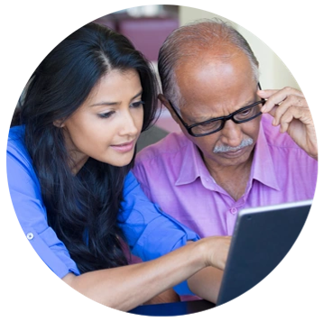 Photo of man and woman looking at a computer screen