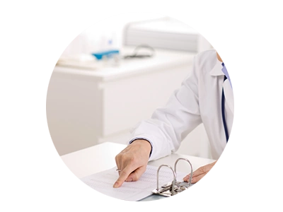 Photo of doctor pointing to chart