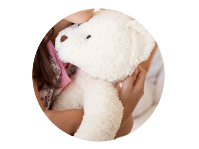 Photo of child holding a teddy bear